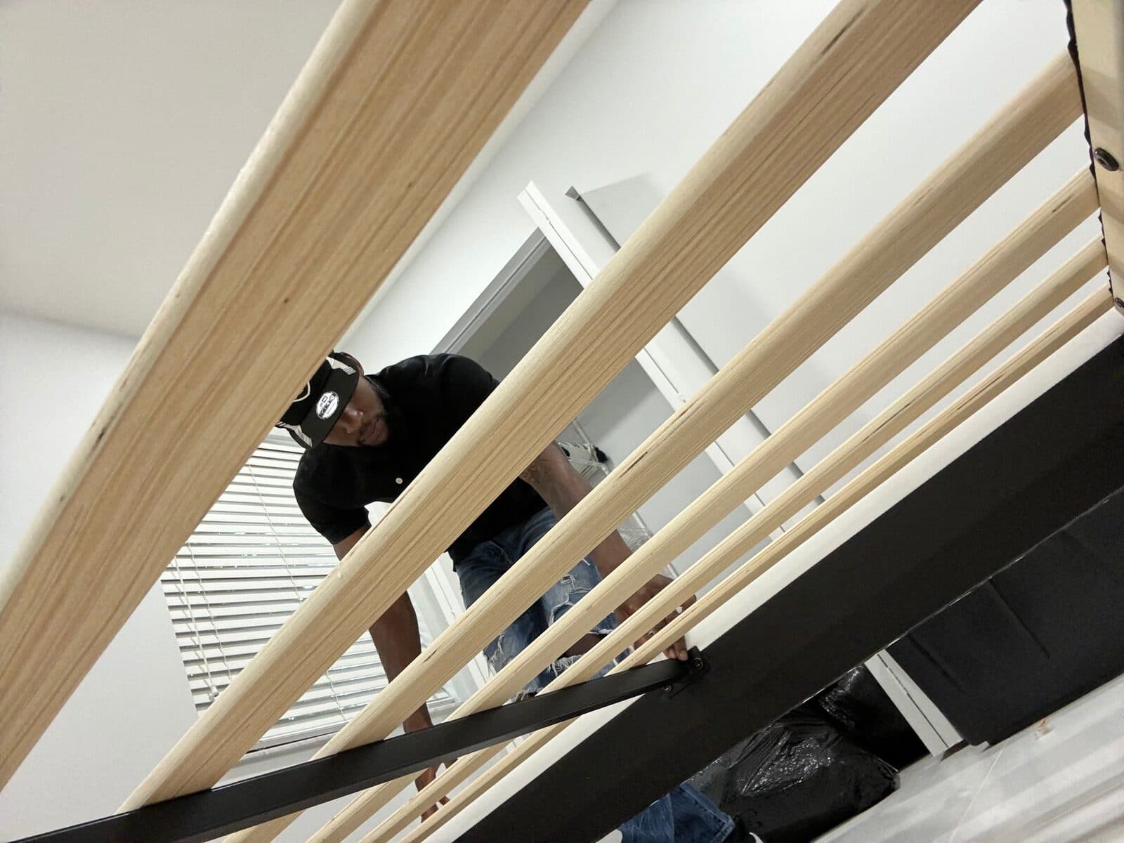 A Cush Moving Company team member carefully carrying panels indoors